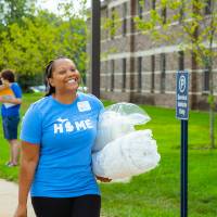 An alumna helps at Move-In